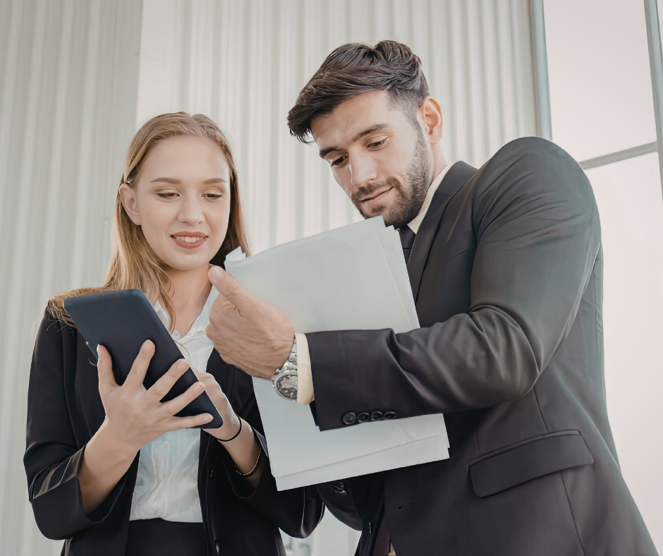 Man and woman looking at paperwork at an office
